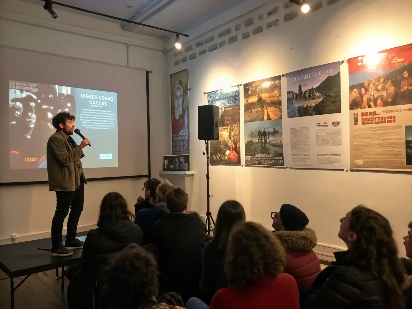An image depicting a film screening event organized by ADAM ASSOC, showing a diverse audience watching a thought-provoking film in a community hall.